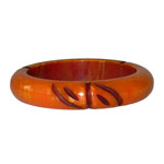 carved orange bakelite bangle