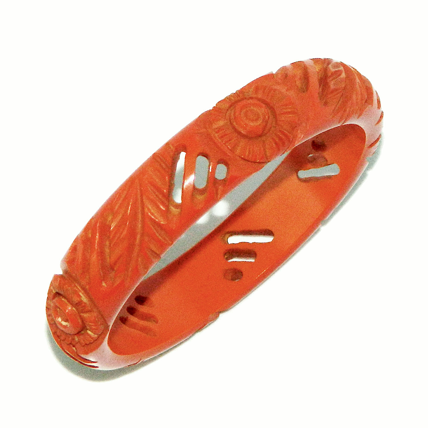 pierced orange carved bakelite bangle