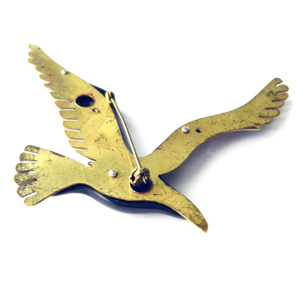 Bakelite and brass bird brooch