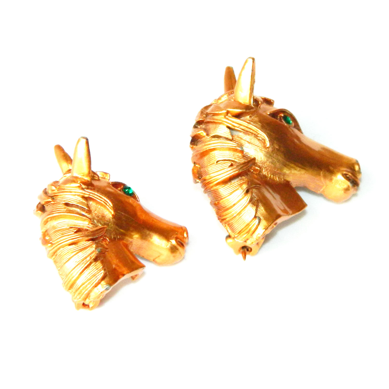 Pair of horse head brooches