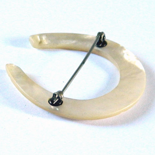 Antique mother of pearl horseshoe brooch
