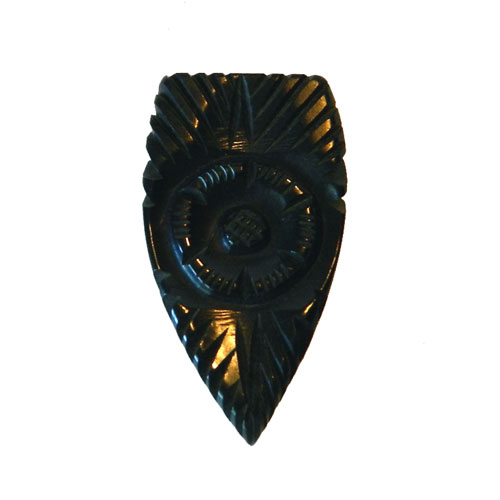 carved bakelite dress clip
