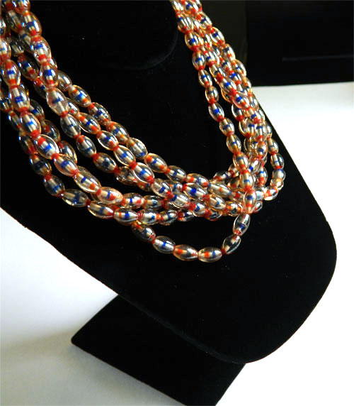 Triple strand blue glass bead necklace