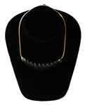 1980s black and gold necklace