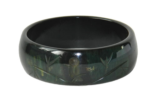 Bakelite bangle with carved bird