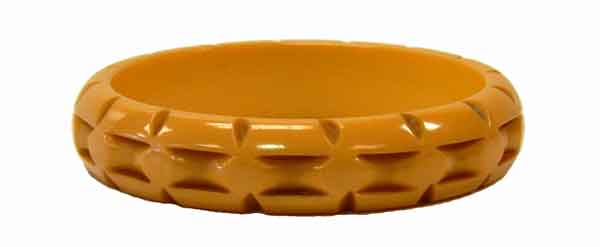 1930's bakelite yellow bangle with a bamboo motif