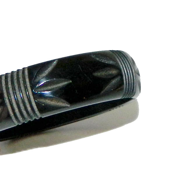 Carved black bakelite bangle