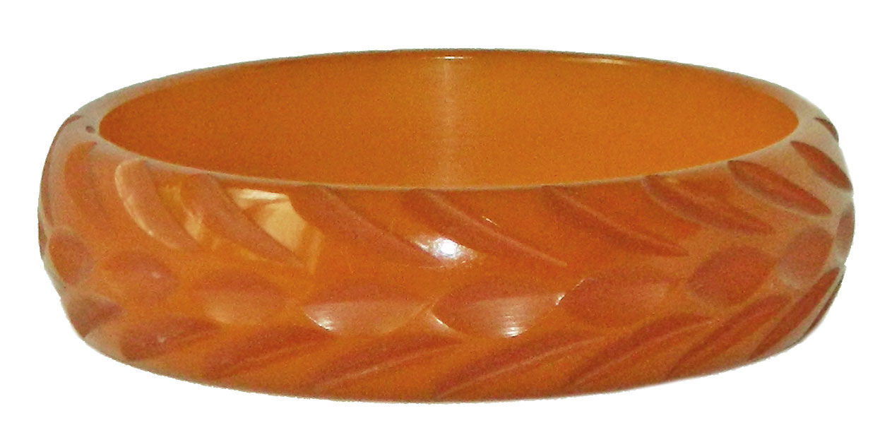Carved orange bakelite bangle