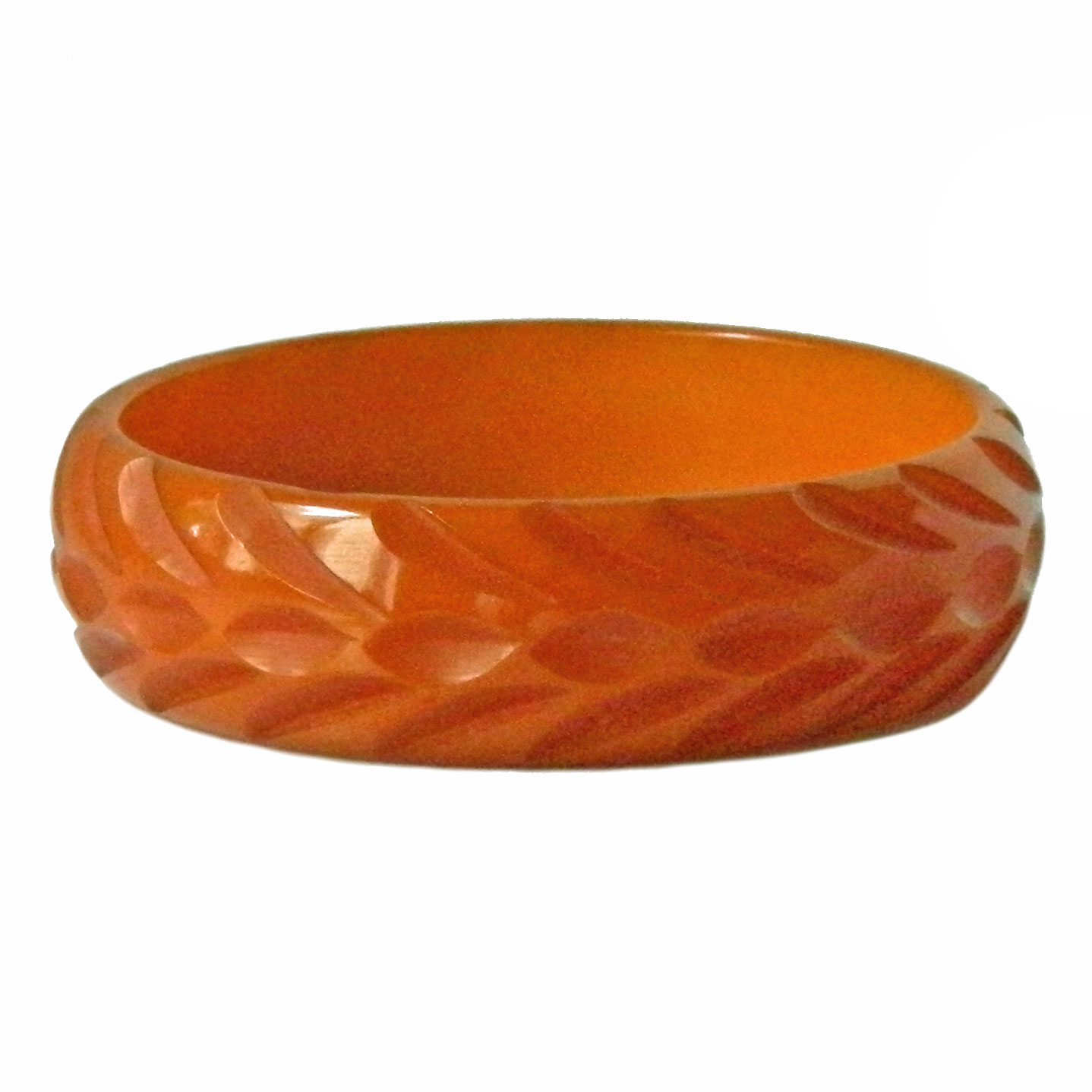 Carved orange bakelite bangle