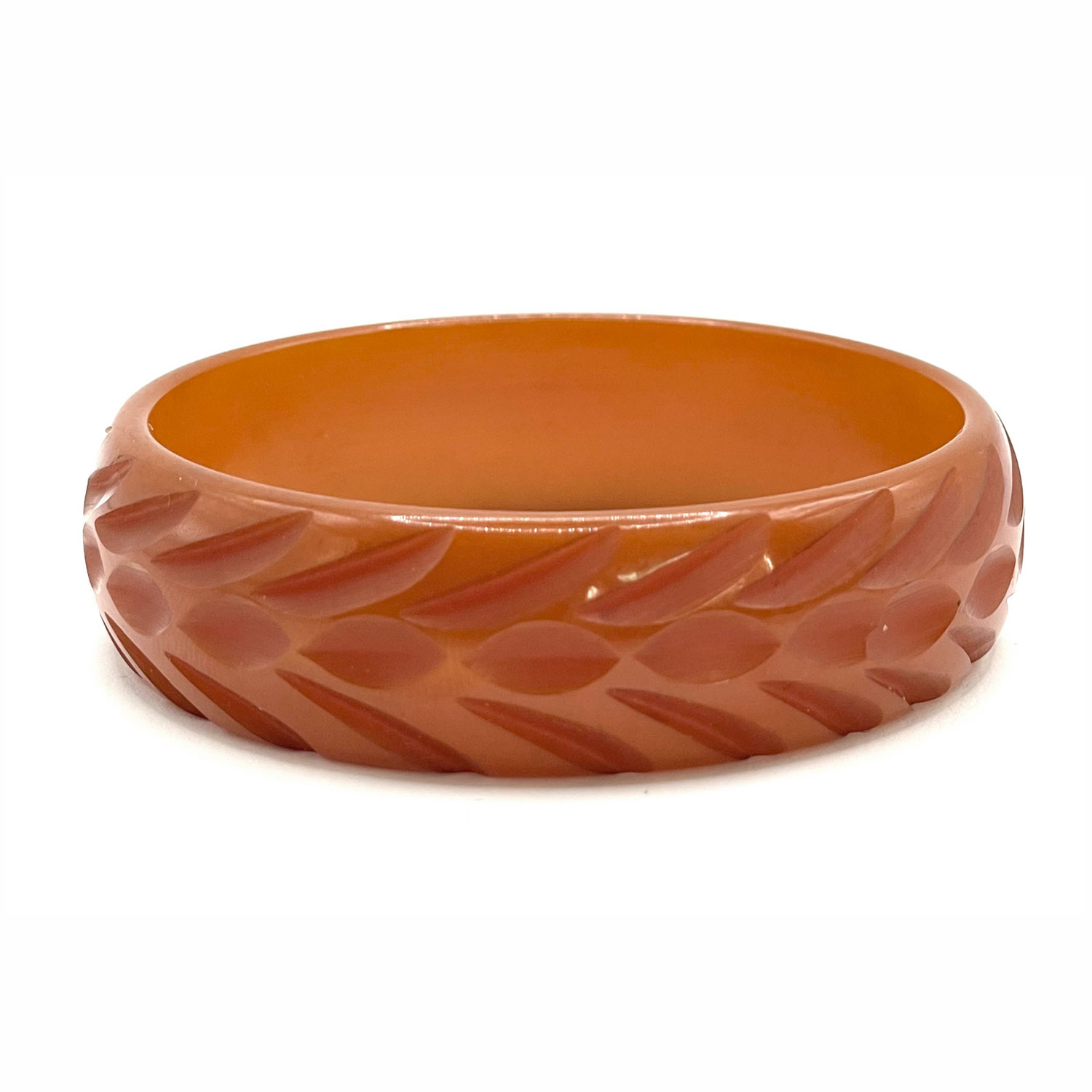 Carved orange bakelite bangle