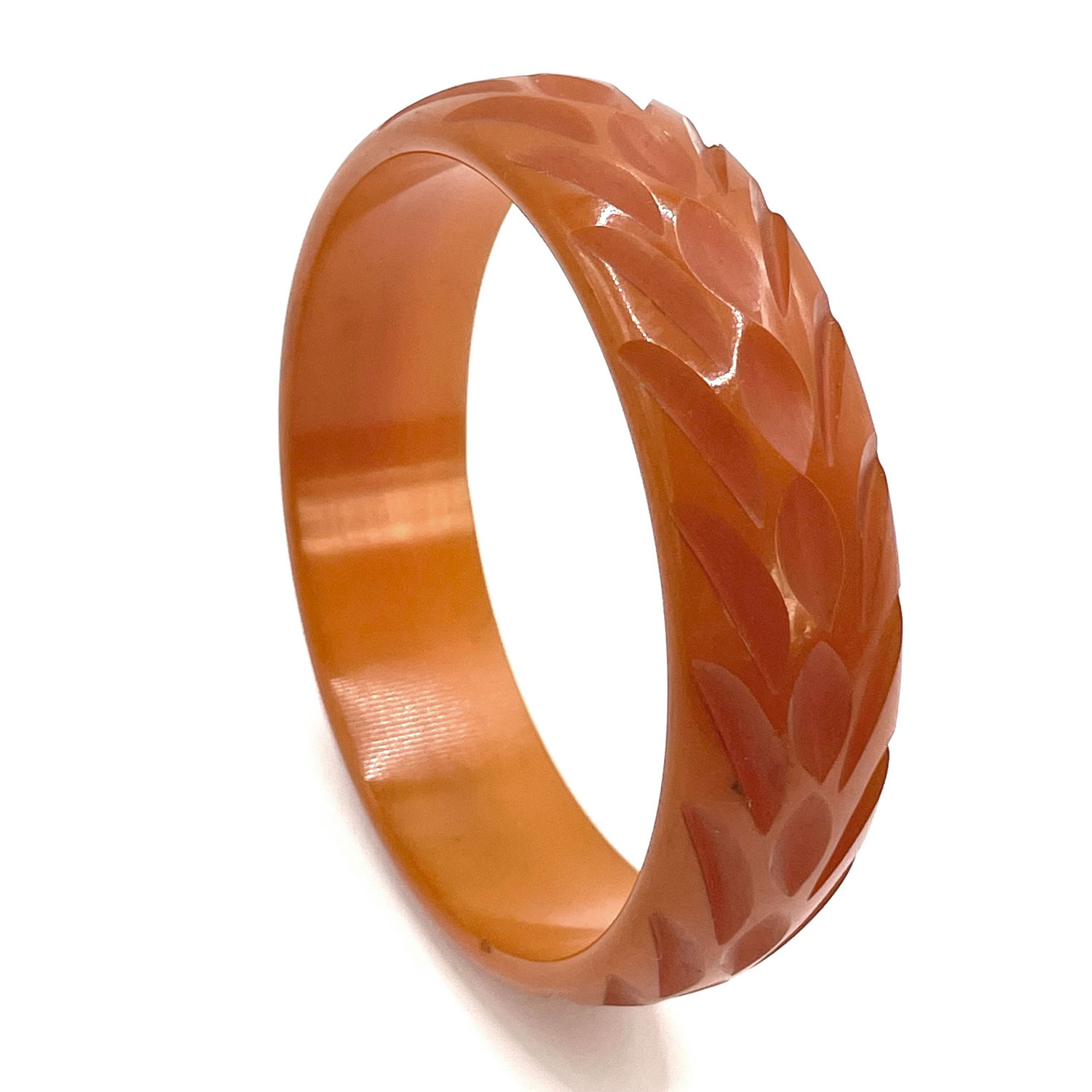 Carved orange bakelite bangle