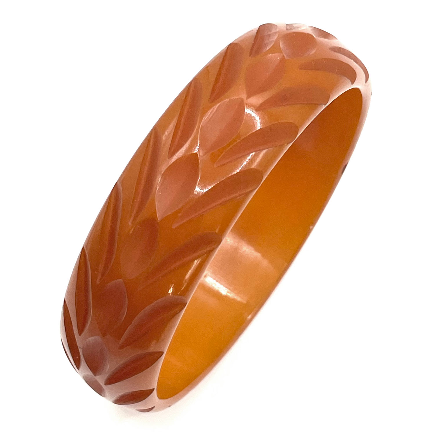 Carved orange bakelite bangle