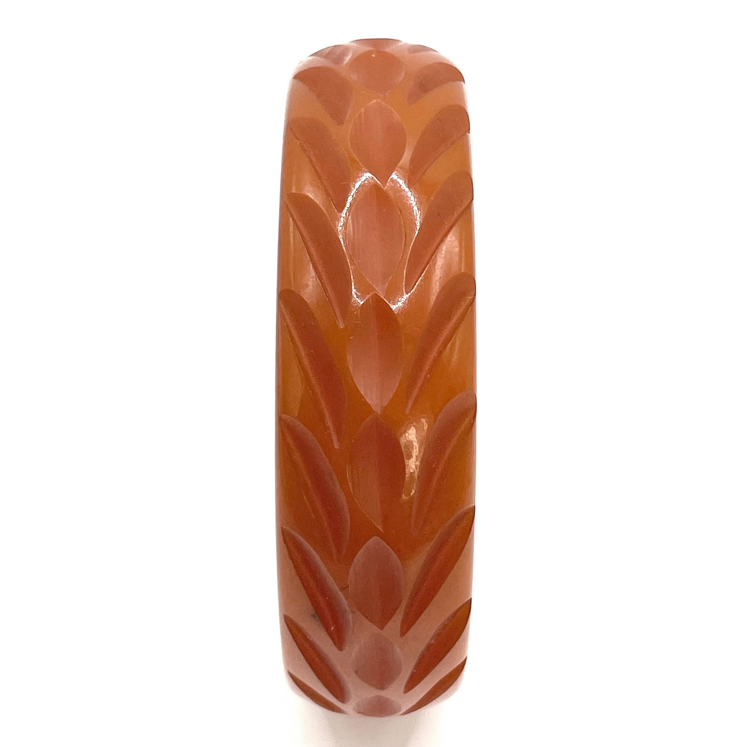 Carved orange bakelite bangle