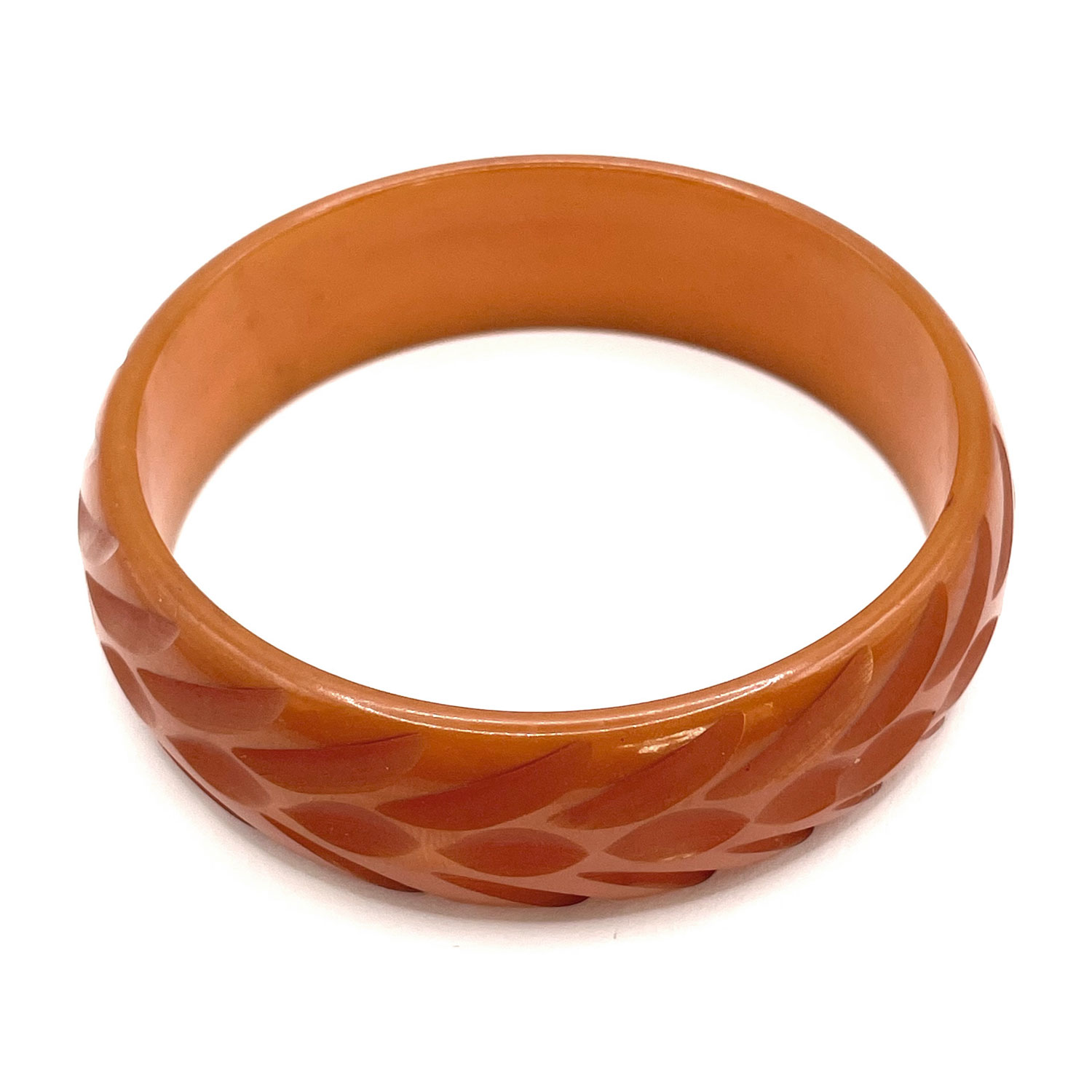 Carved orange bakelite bangle