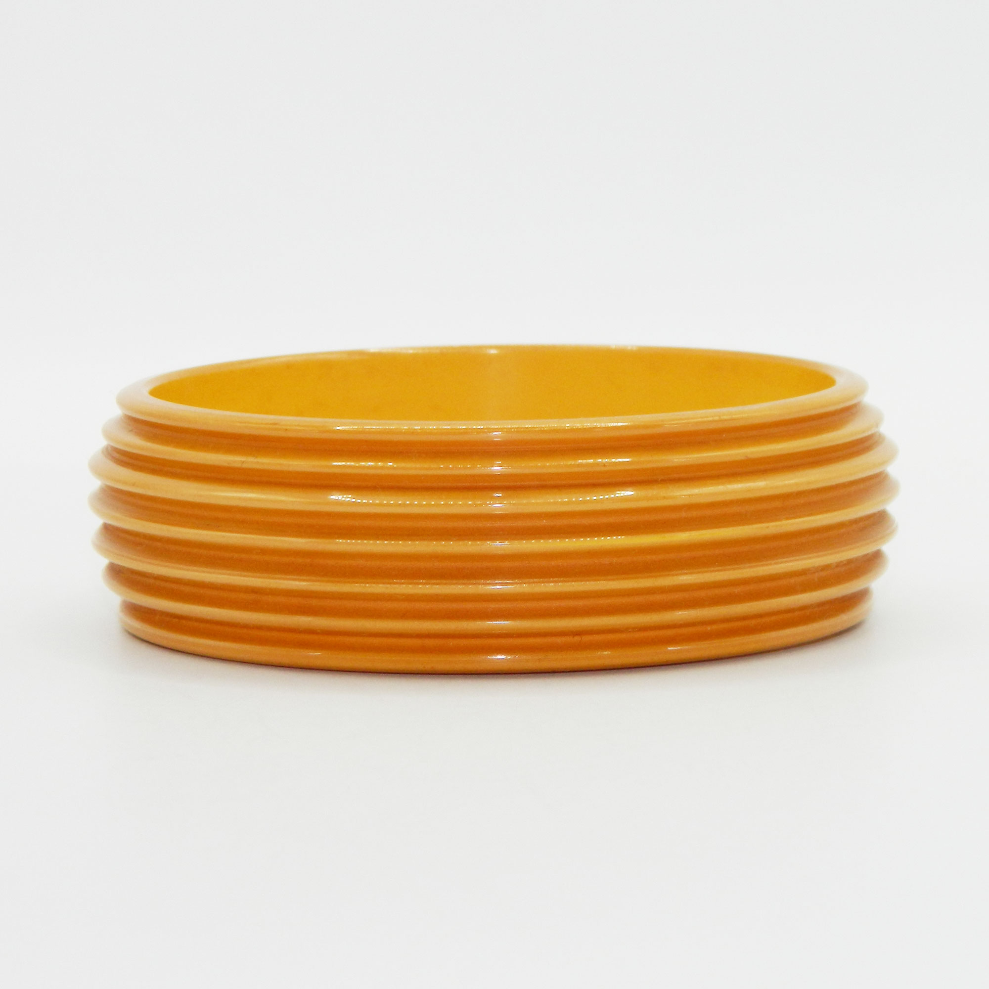 Carved yellow bakelite bangle