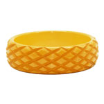 carved yellow bakelite bangle