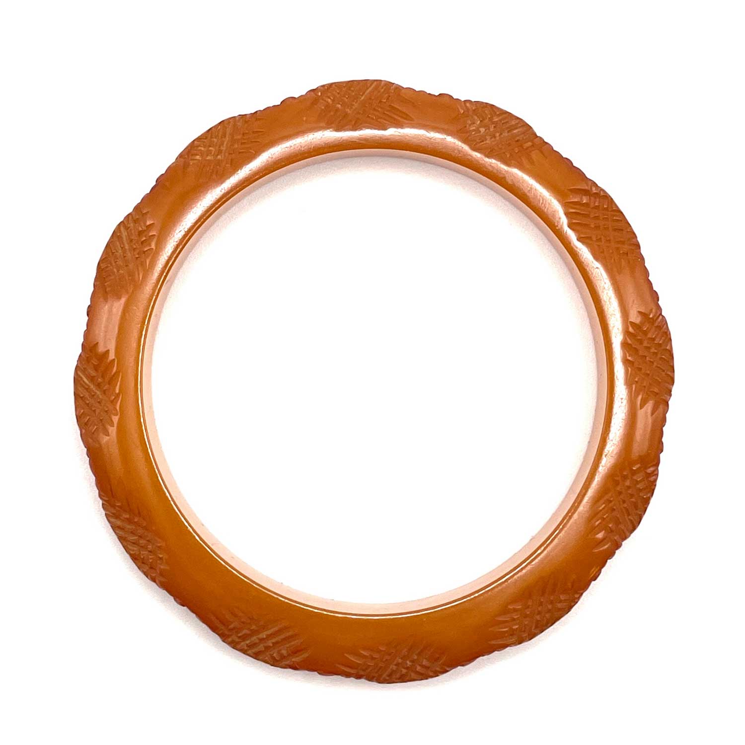 Carved burnt orange bakelite bangle