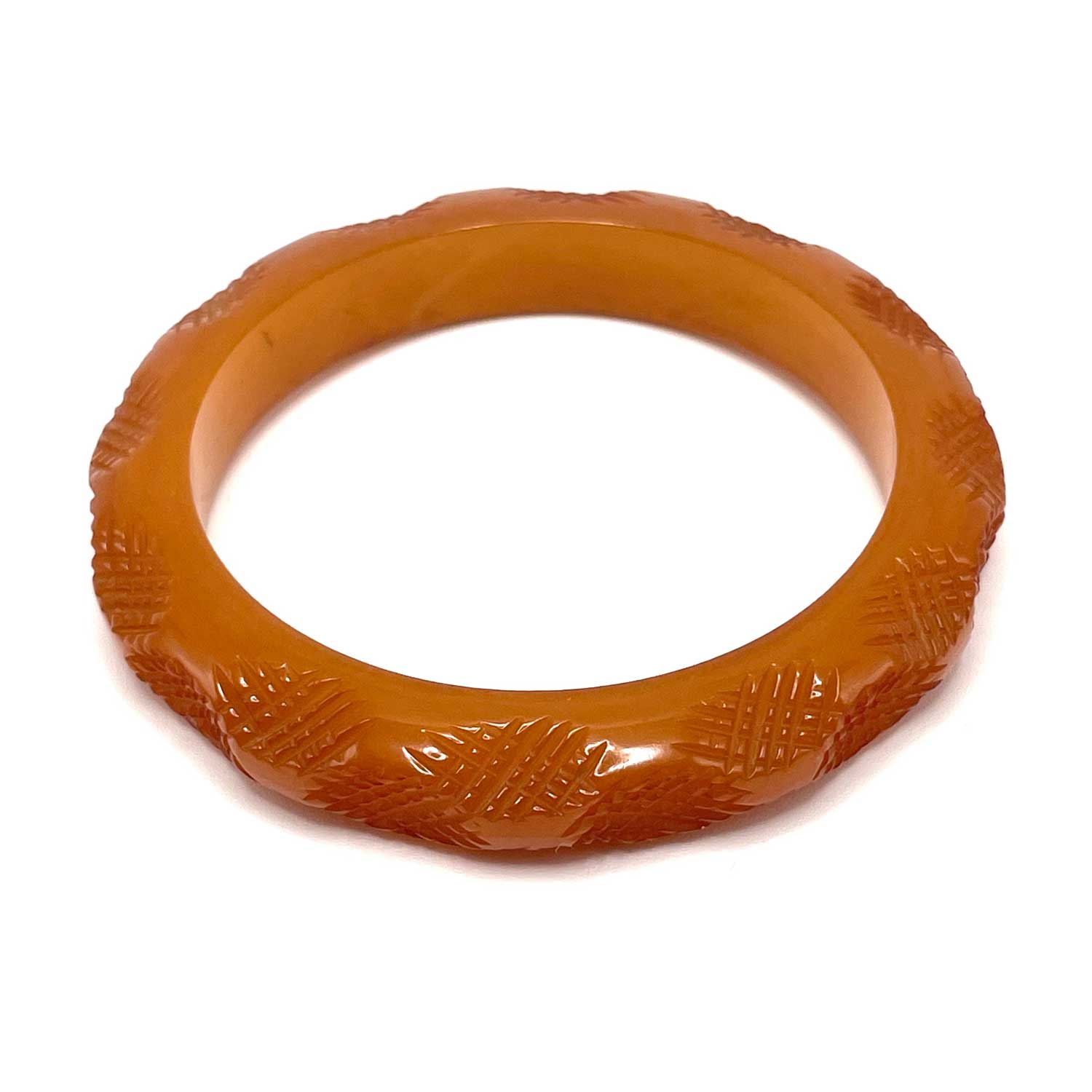 Carved burnt orange bakelite bangle