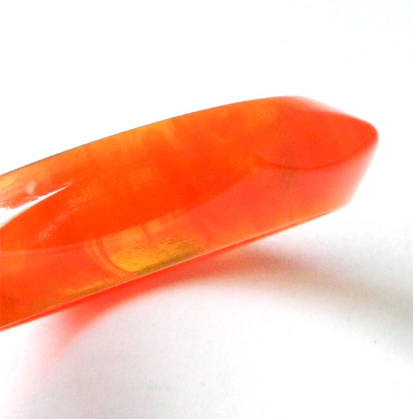 Faceted orange bakelite bangle