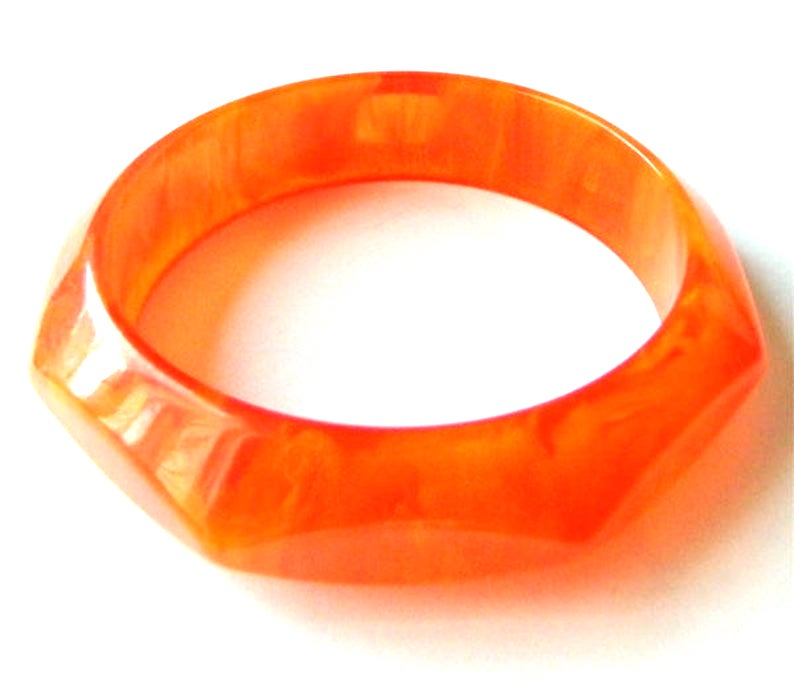 Faceted orange bakelite bangle