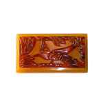 Carved bakelite bird brooch