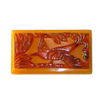 Carved bakelite bird brooch