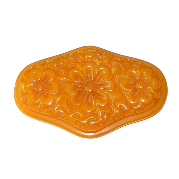 Hand carved bakelite brooch