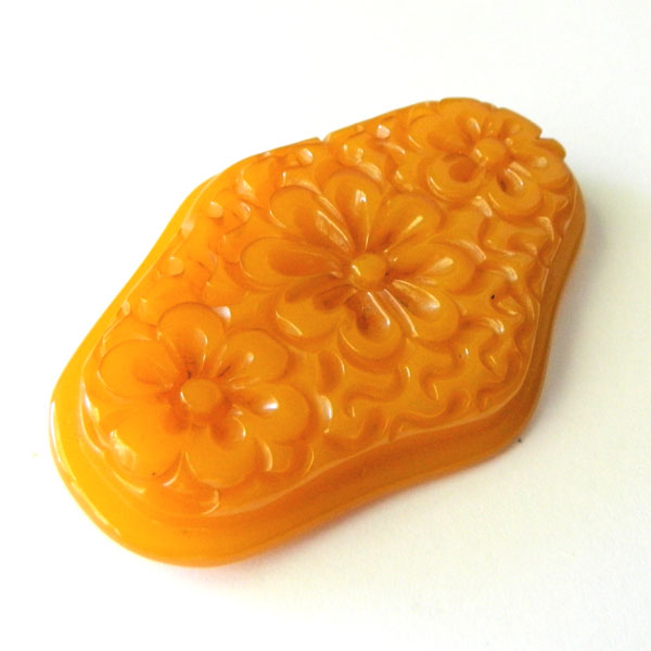 Hand carved bakelite brooch