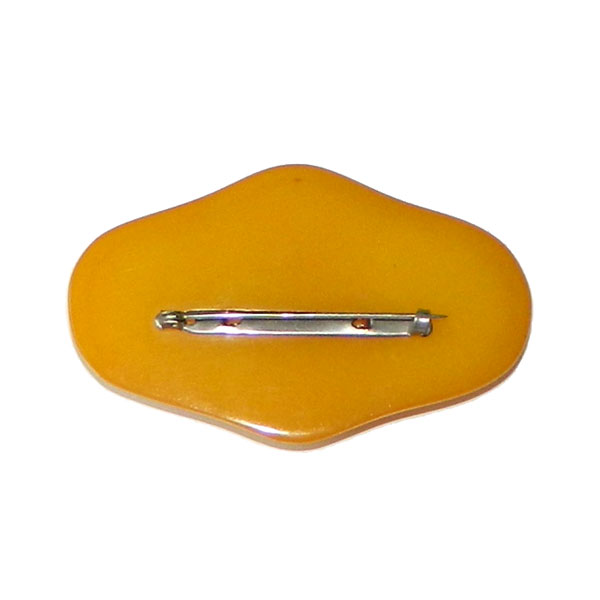 Hand carved bakelite brooch