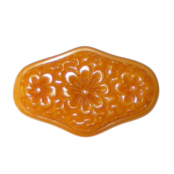 Hand carved bakelite brooch