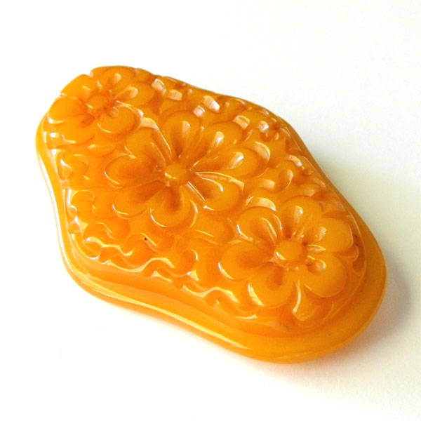 Hand carved bakelite brooch