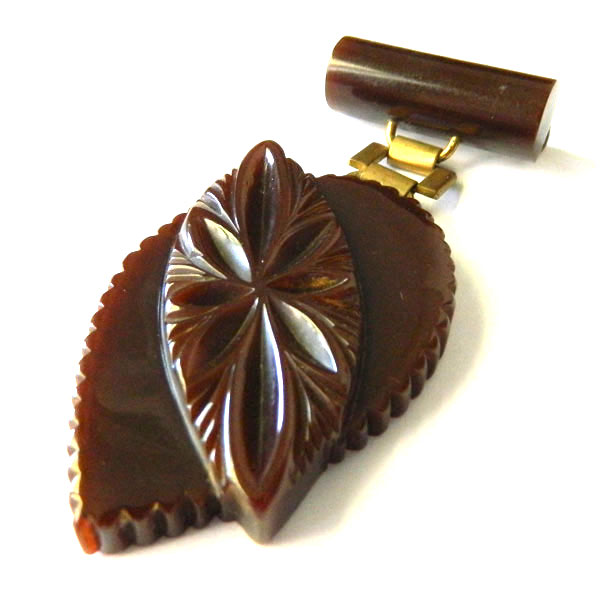 Hand carved bakelite brooch