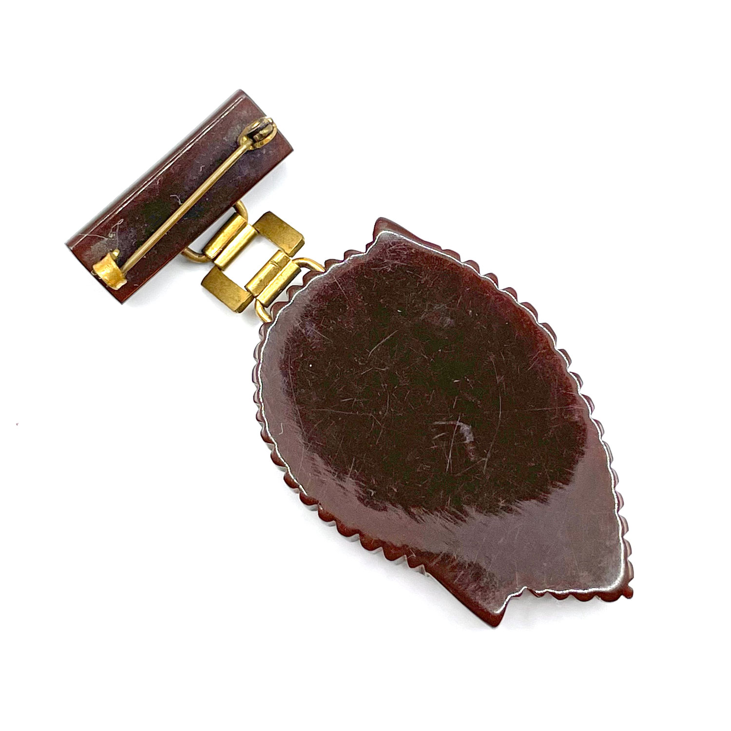 Hand carved bakelite brooch
