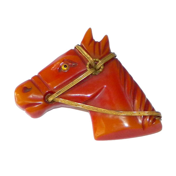 Hand carved bakelite brooch