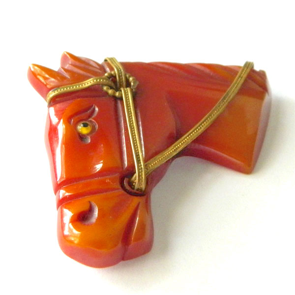 Hand carved bakelite brooch