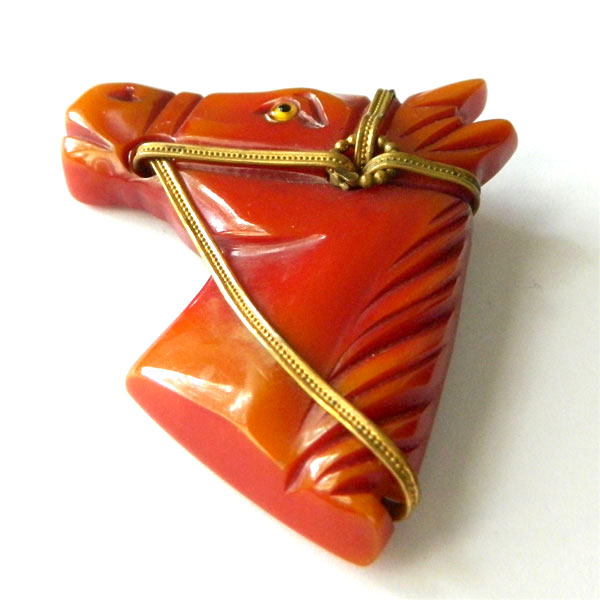 Hand carved bakelite brooch