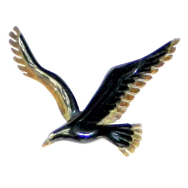 Bakelite and brass bird brooch