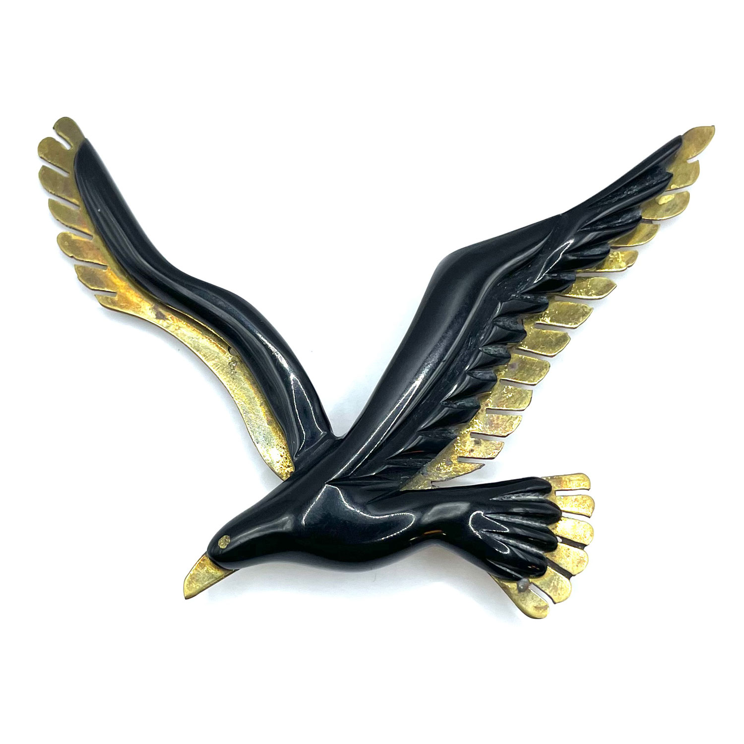 Bakelite and brass bird brooch
