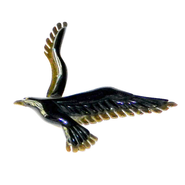 Bakelite and brass bird brooch