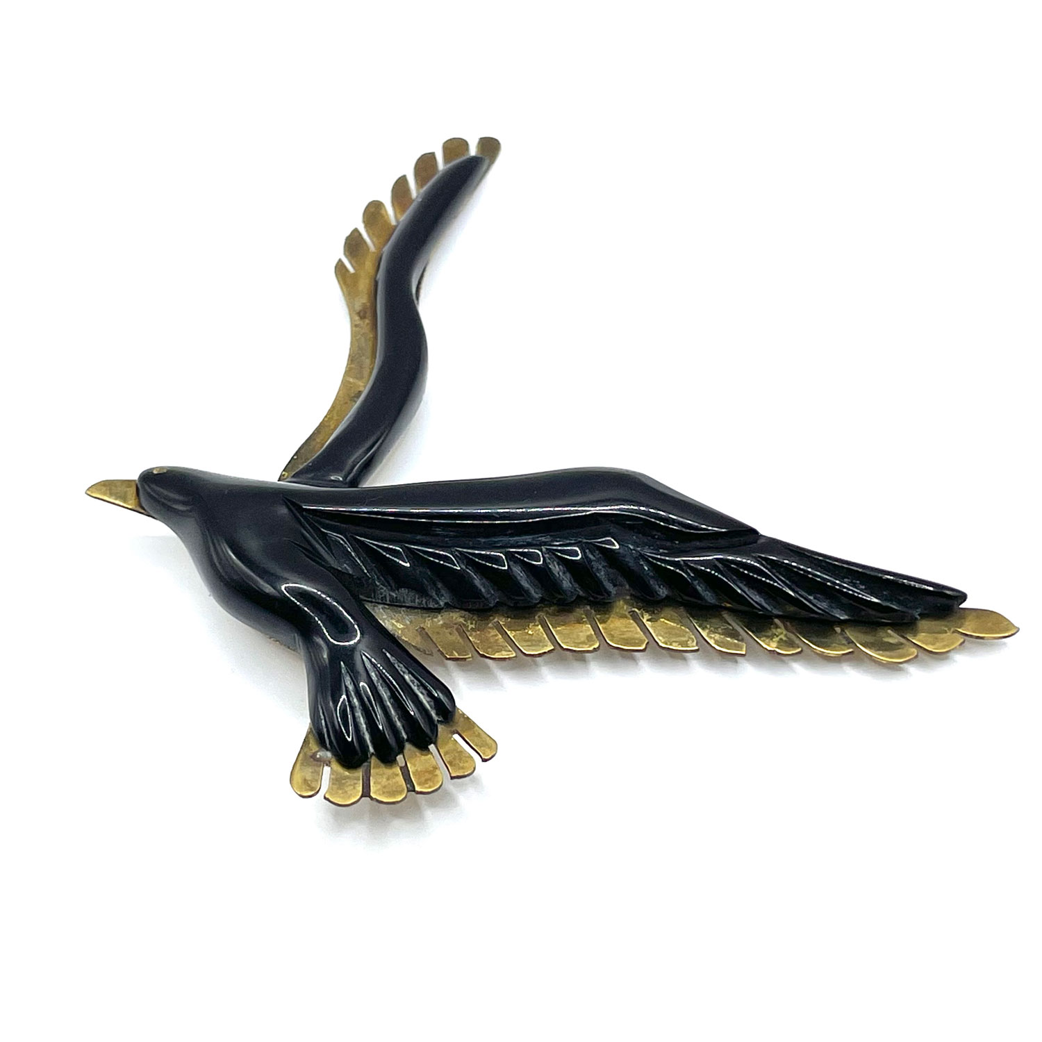 Bakelite and brass bird brooch