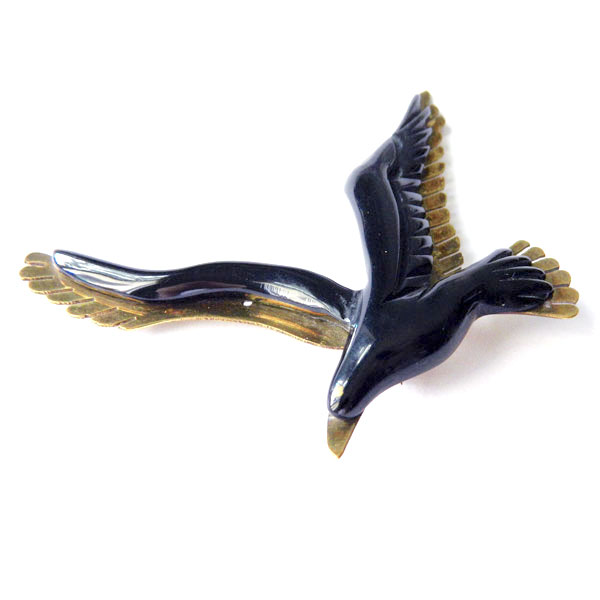 Bakelite and brass bird brooch