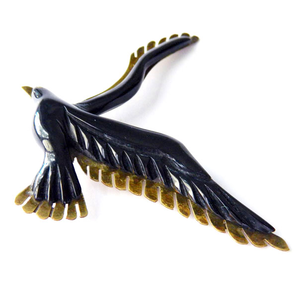 Bakelite and brass bird brooch