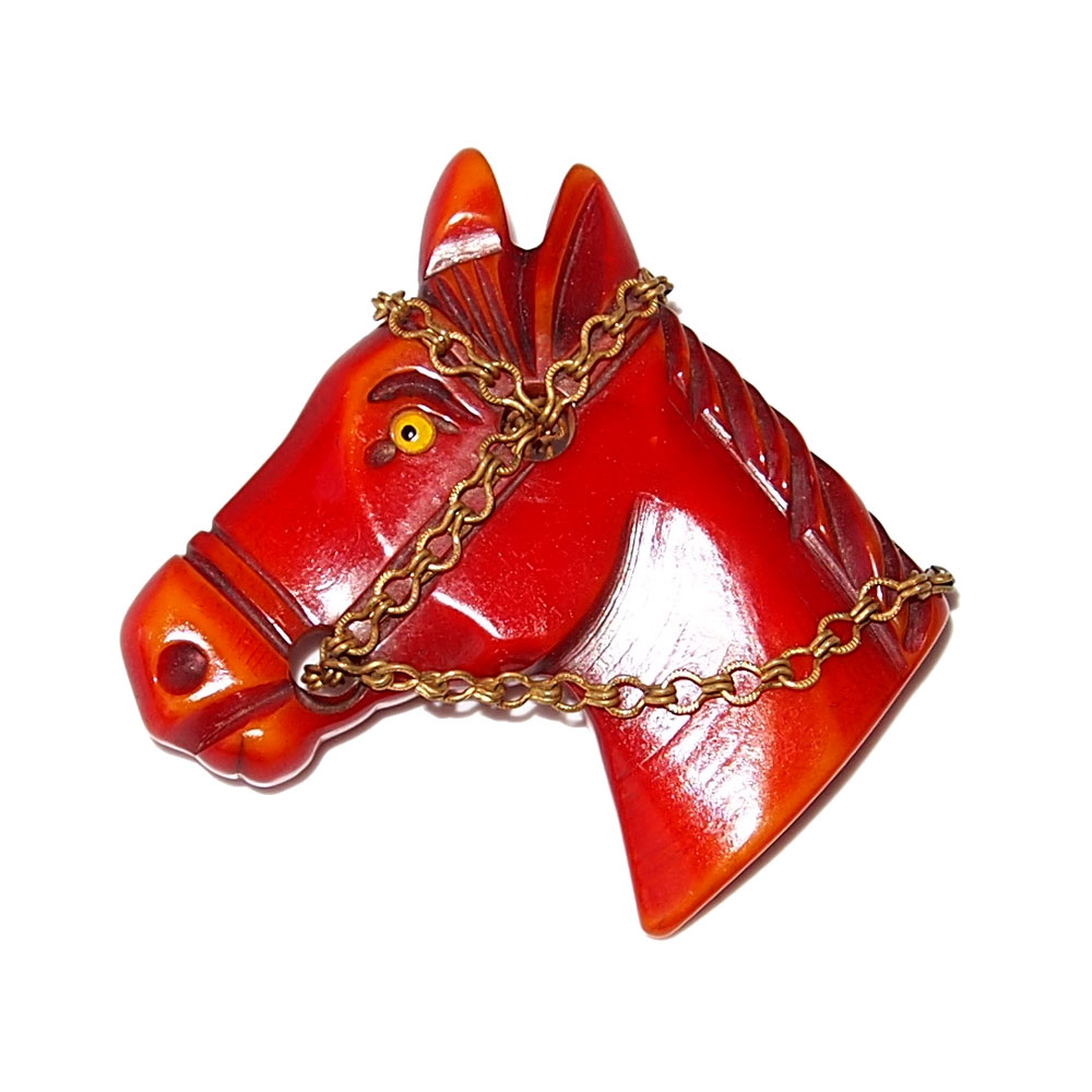 Hand carved bakelite brooch