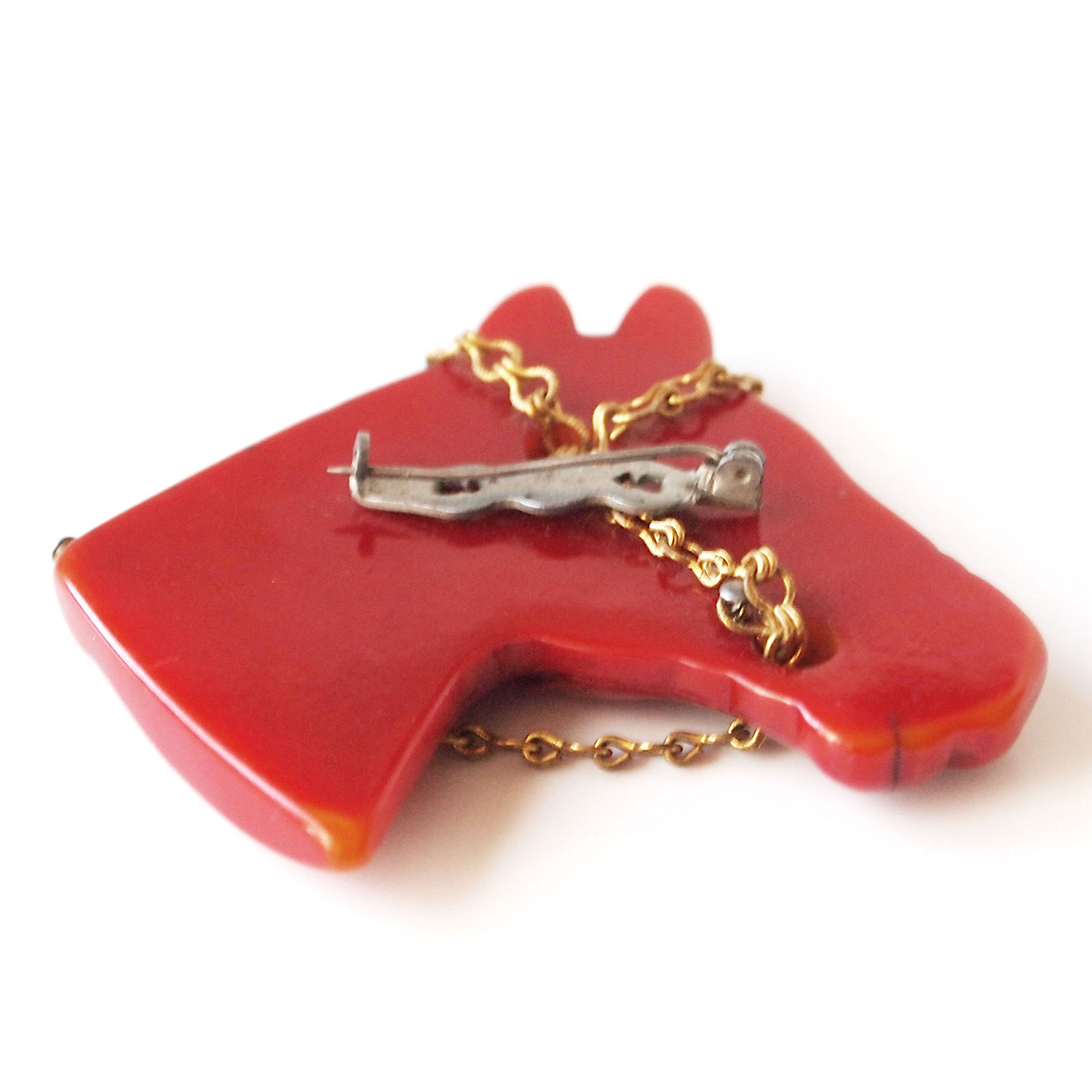 Hand carved bakelite brooch