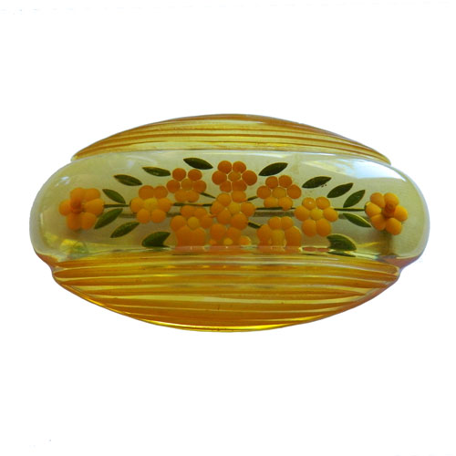 reverse carved bakelite brooch