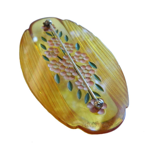 reverse carved bakelite brooch