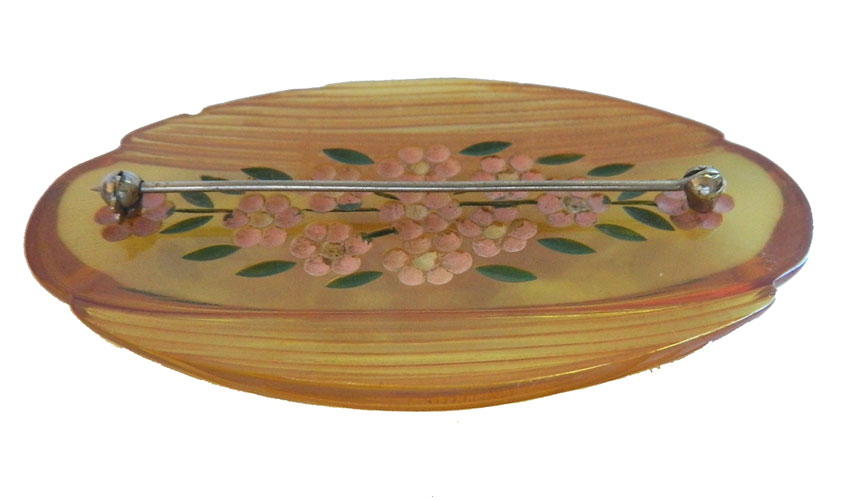 reverse carved bakelite brooch