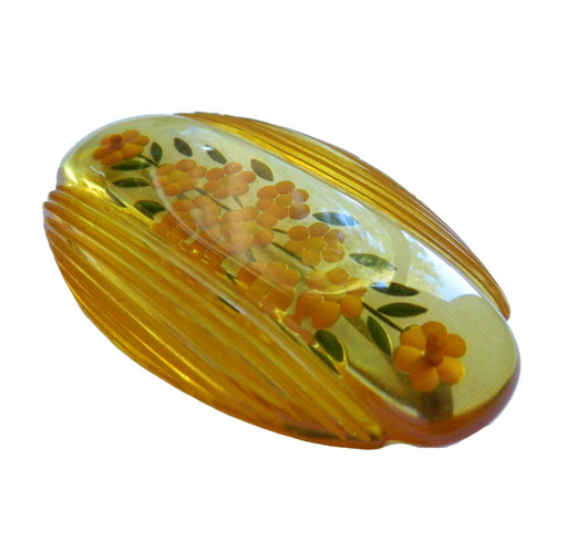 reverse carved bakelite brooch