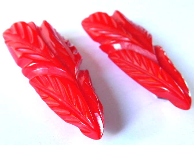 carved bakelite dress clips