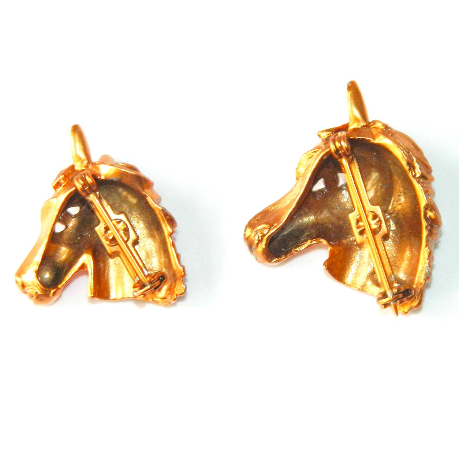 Pair of horse head brooches